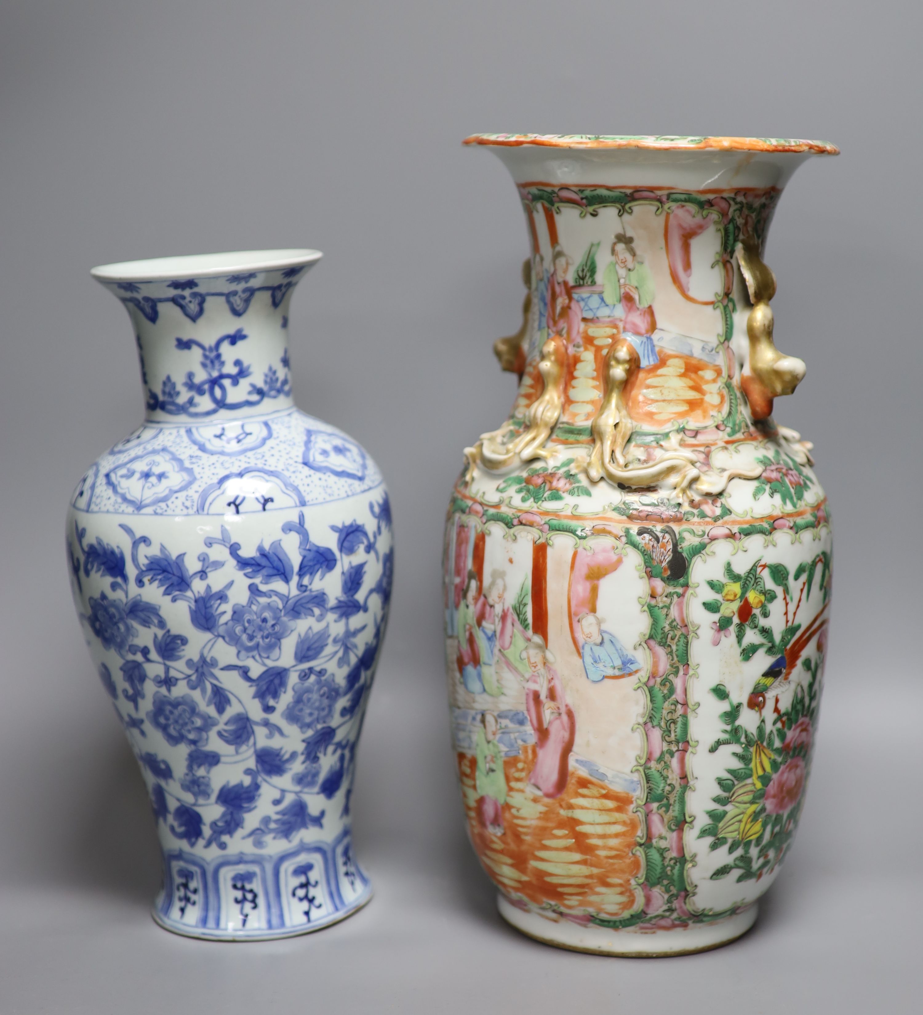 A Chinese famille rose Canton vase, a pair of blue and white vases and two others, tallest 35.5cm